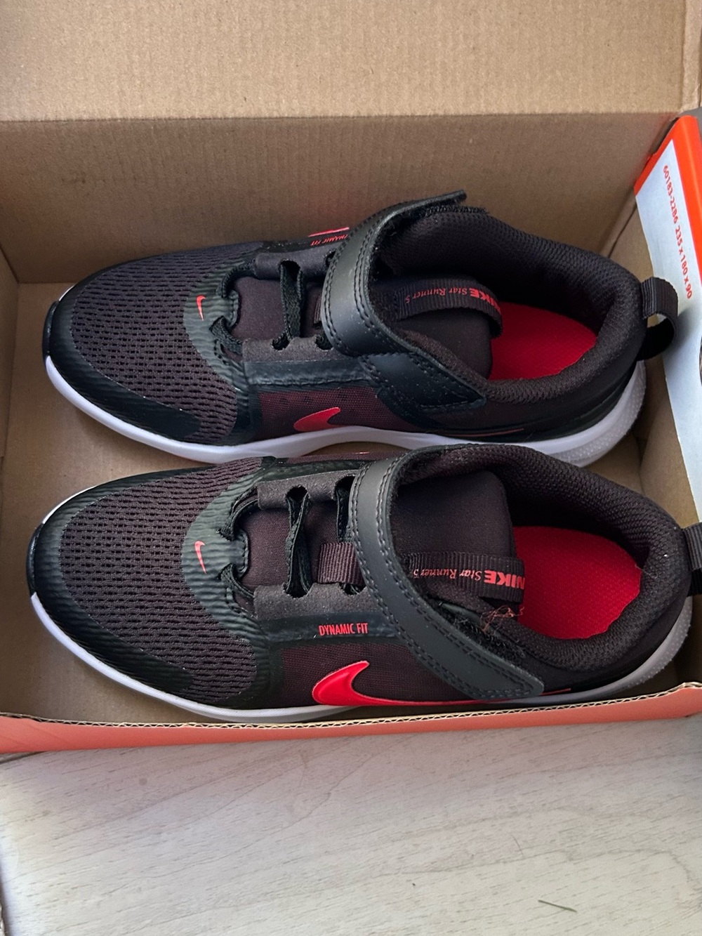 Nike Kids Black Sneakers with Red Accents